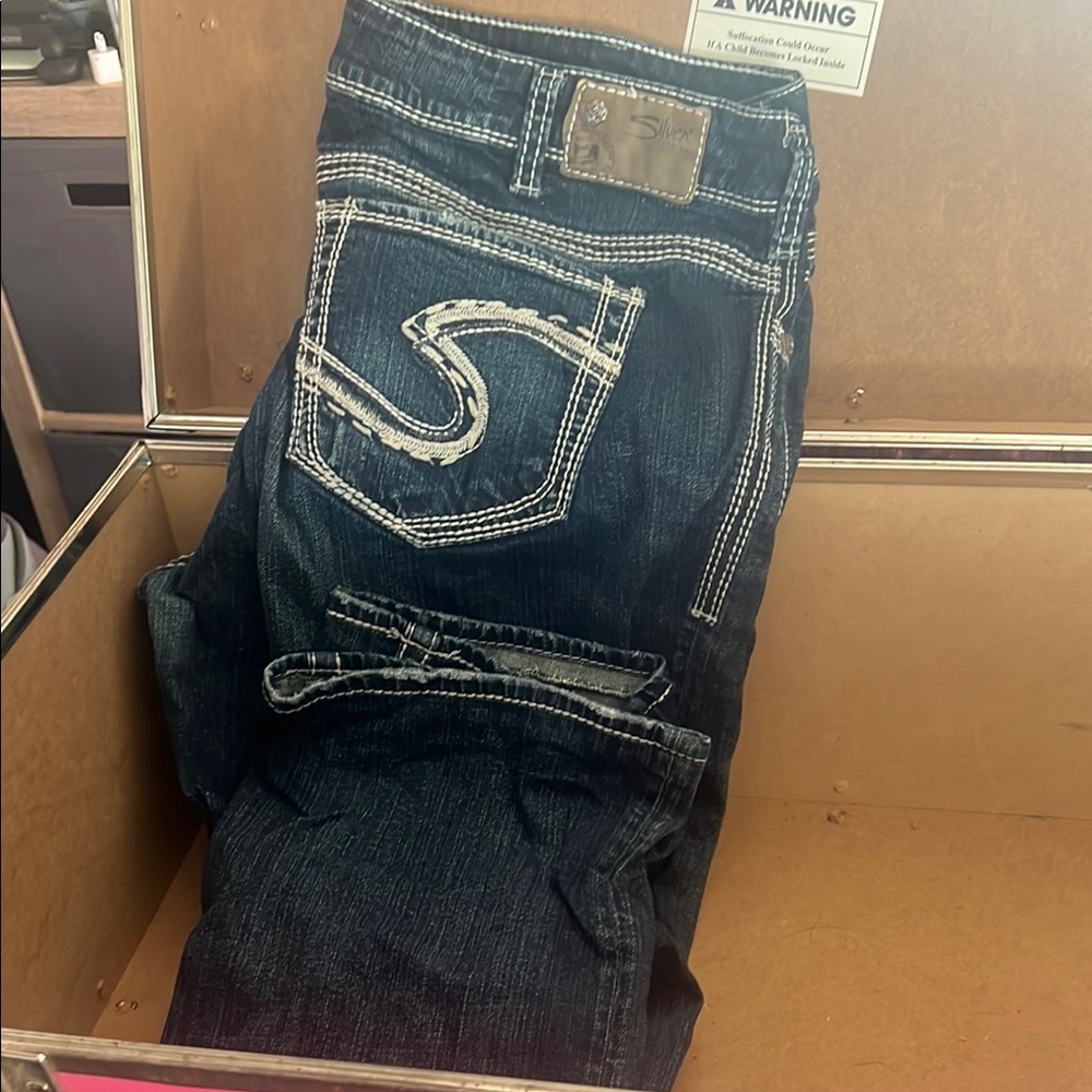 Woman’s Dark Blue Silver Jeans